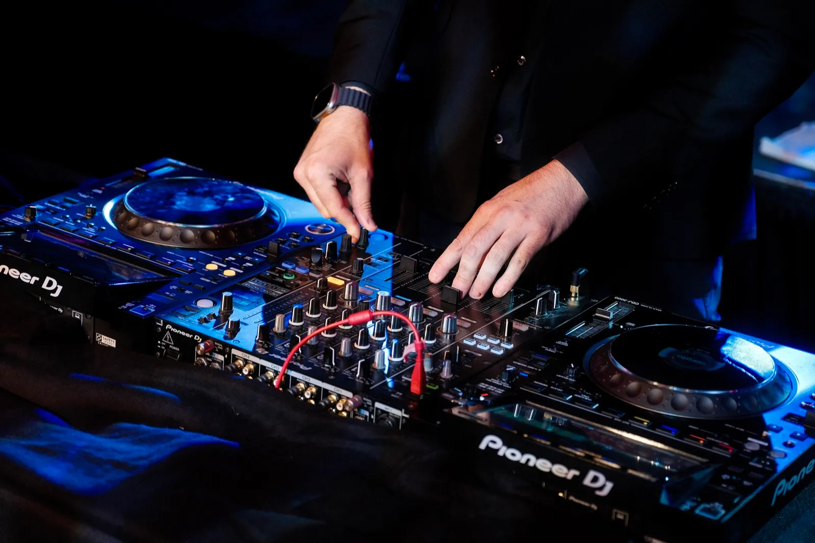 DJ equipment with moody blue lighting